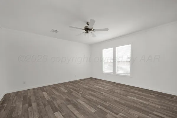 a room with cabinets and stainless steel appliances