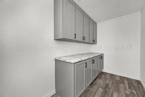 a view of a kitchen with a sink and a stove top oven