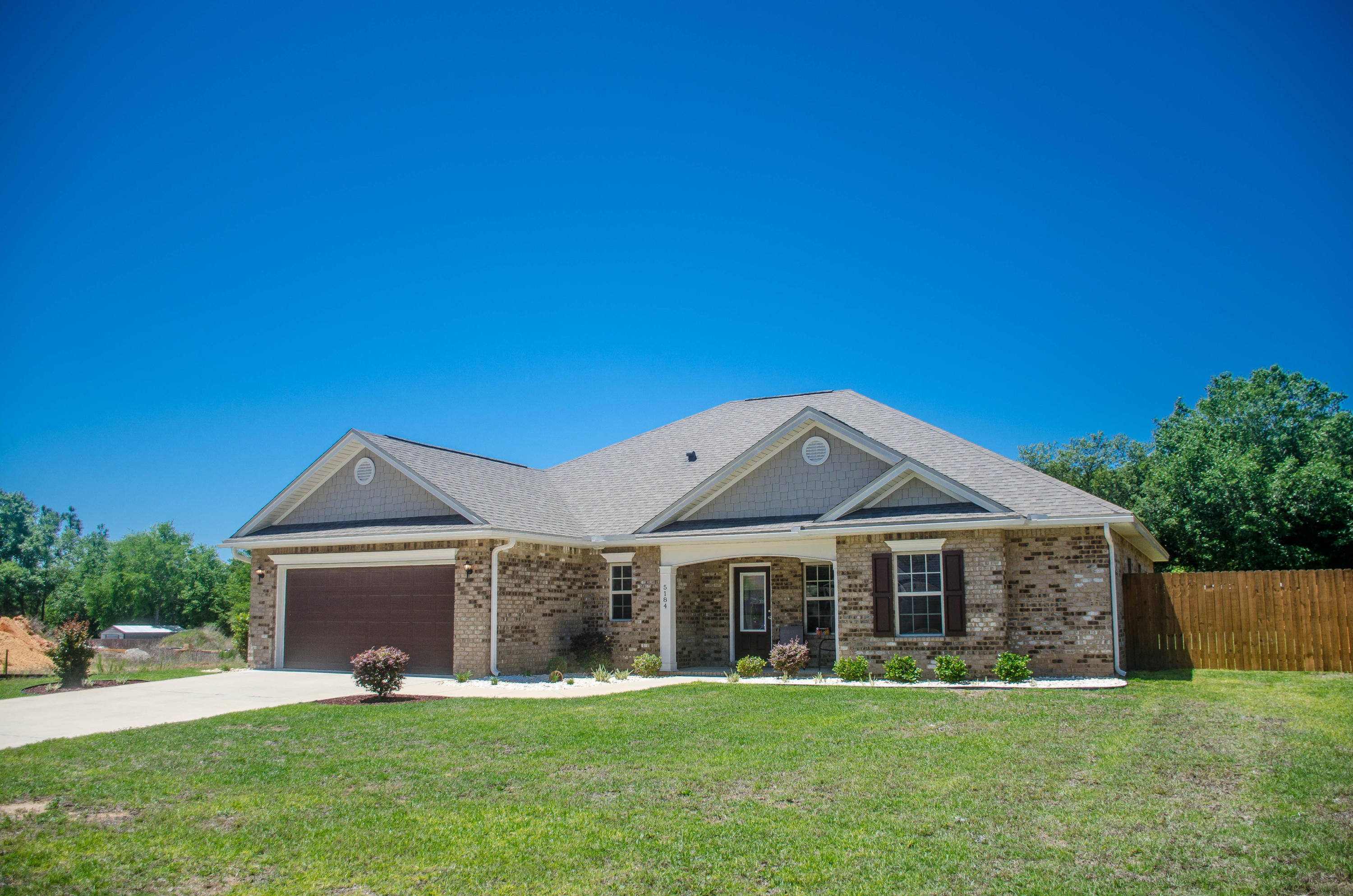 5184 Rabbit Crestview, FL 32539 - Photo 1 of 31 a front view of a house with a yard and trees