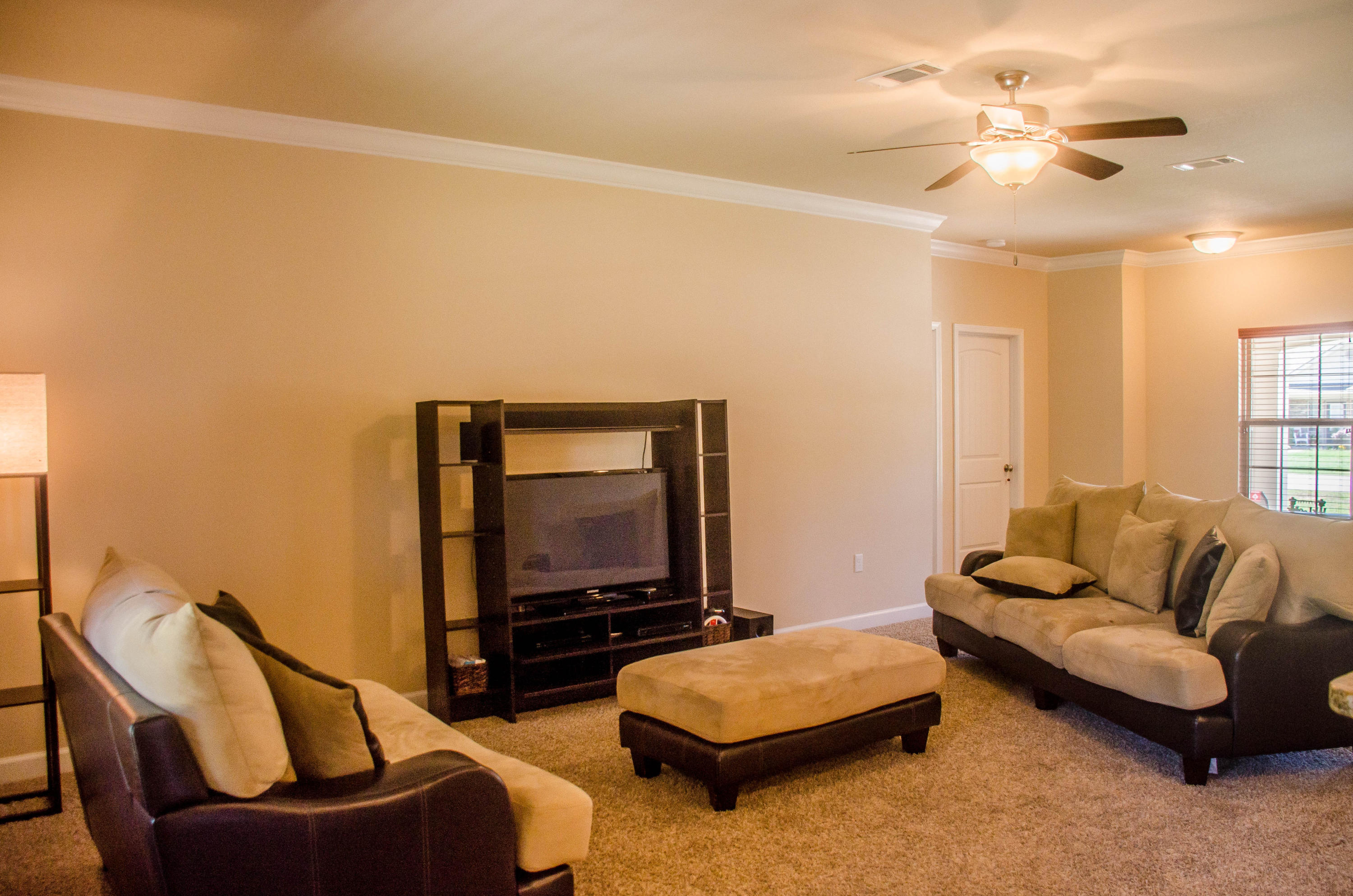 5184 Rabbit Crestview, FL 32539 - Photo 14 of 31 a living room with furniture and a flat screen tv