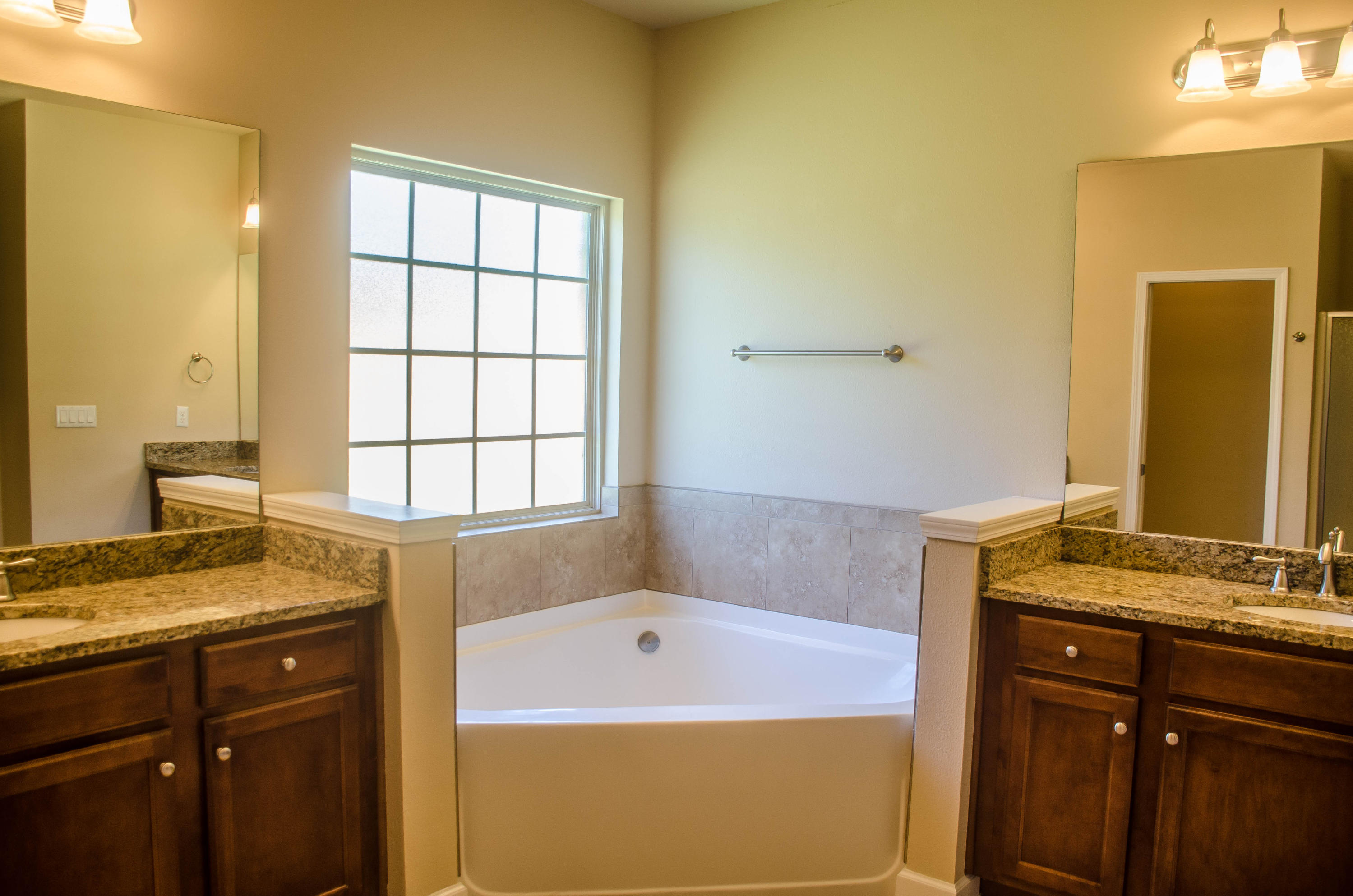 5184 Rabbit Crestview, FL 32539 - Photo 18 of 31 a bathroom with a granite countertop sink and a bathtub