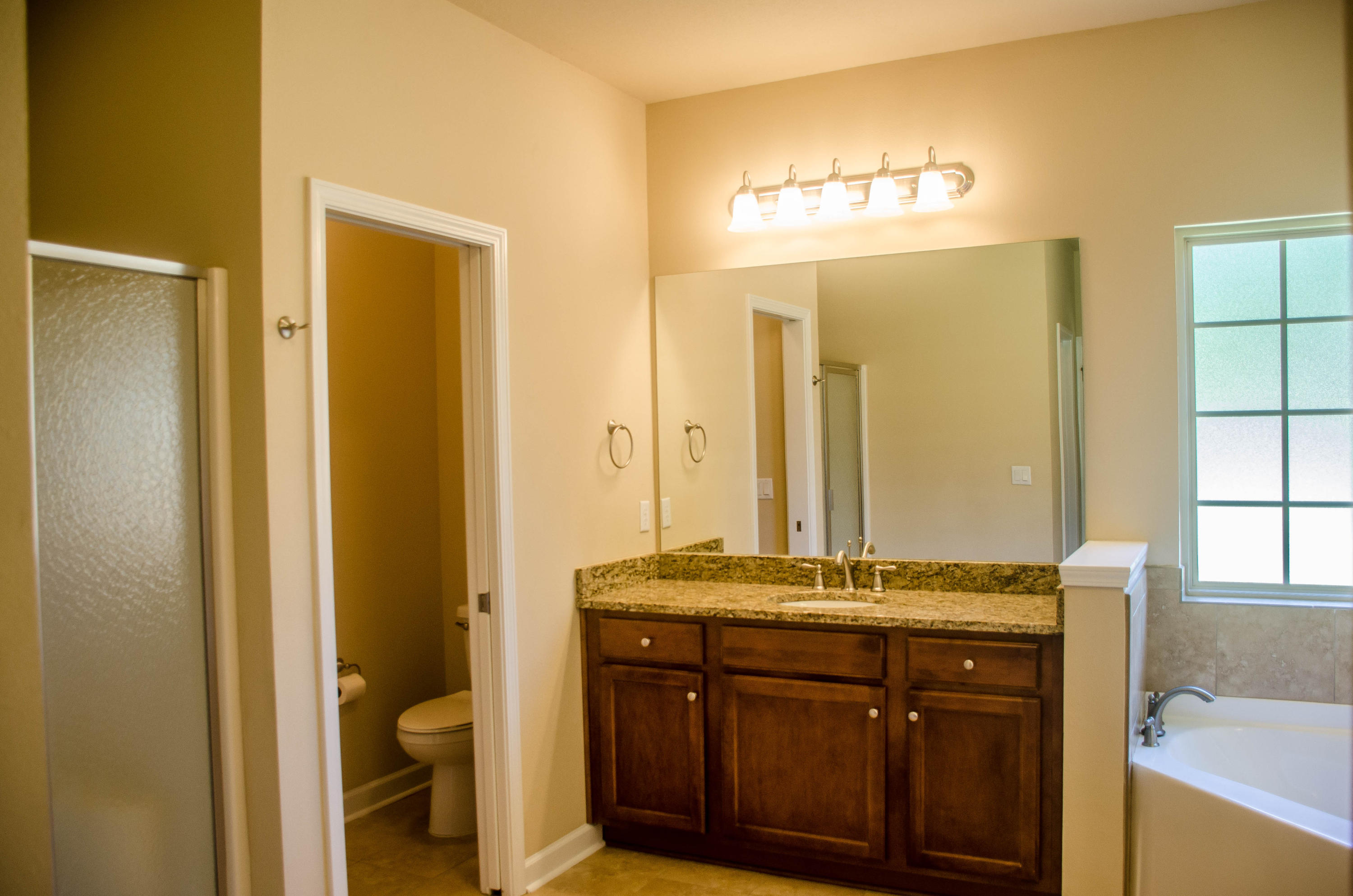 5184 Rabbit Crestview, FL 32539 - Photo 20 of 31 a bathroom with a granite countertop sink and a mirror