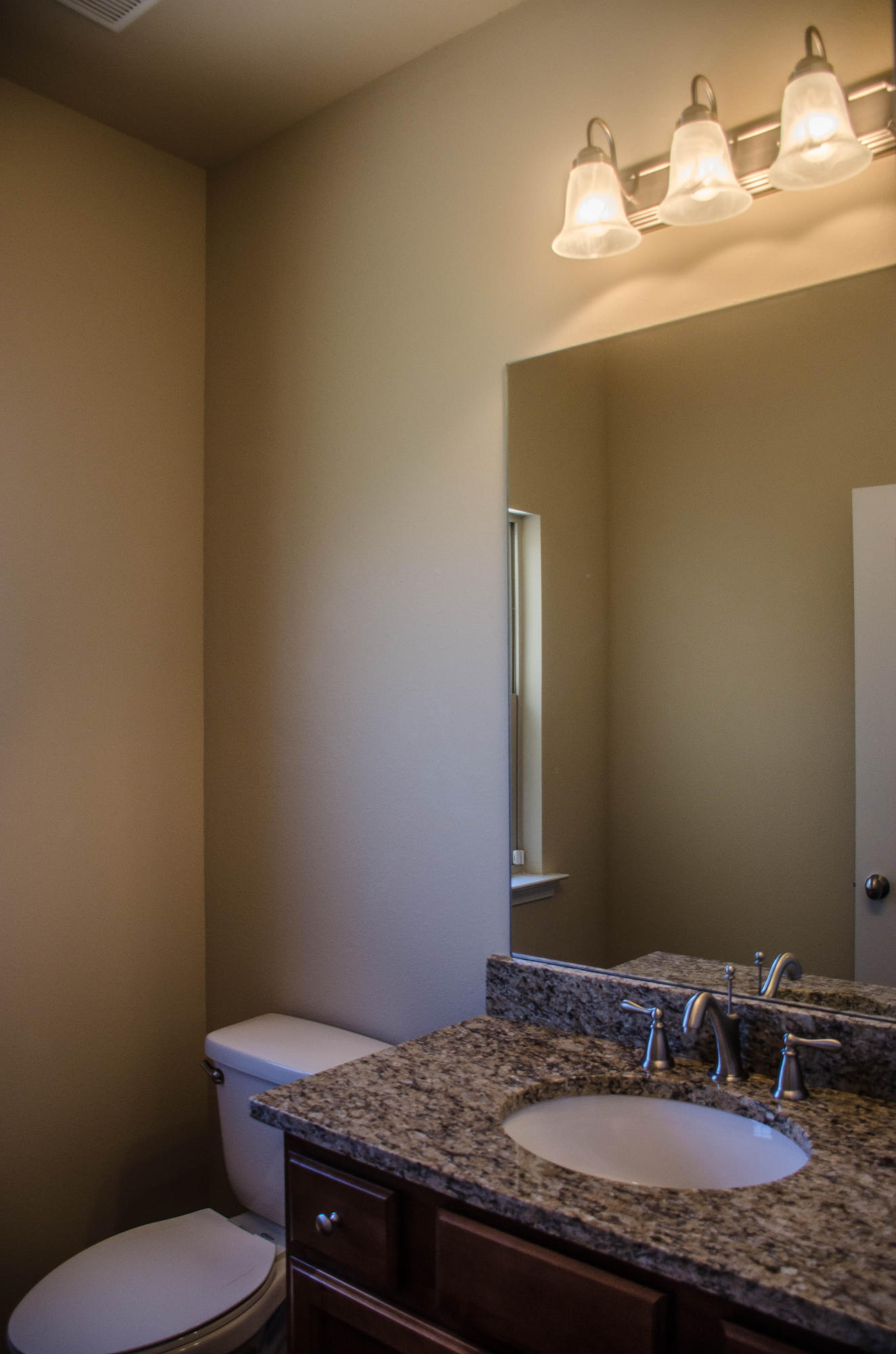 5184 Rabbit Crestview, FL 32539 - Photo 22 of 31 a bathroom with a granite countertop sink and a mirror