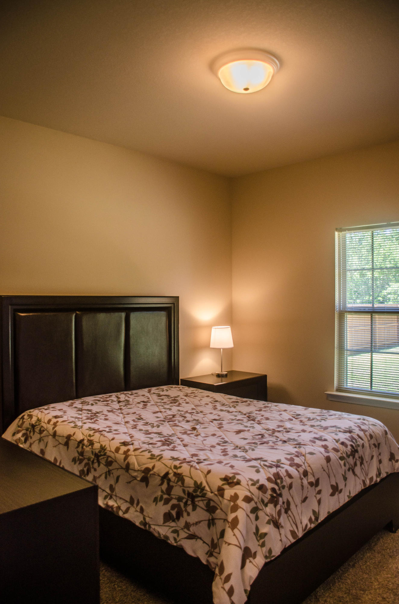 5184 Rabbit Crestview, FL 32539 - Photo 23 of 31 a bedroom with a large bed and a chandelier