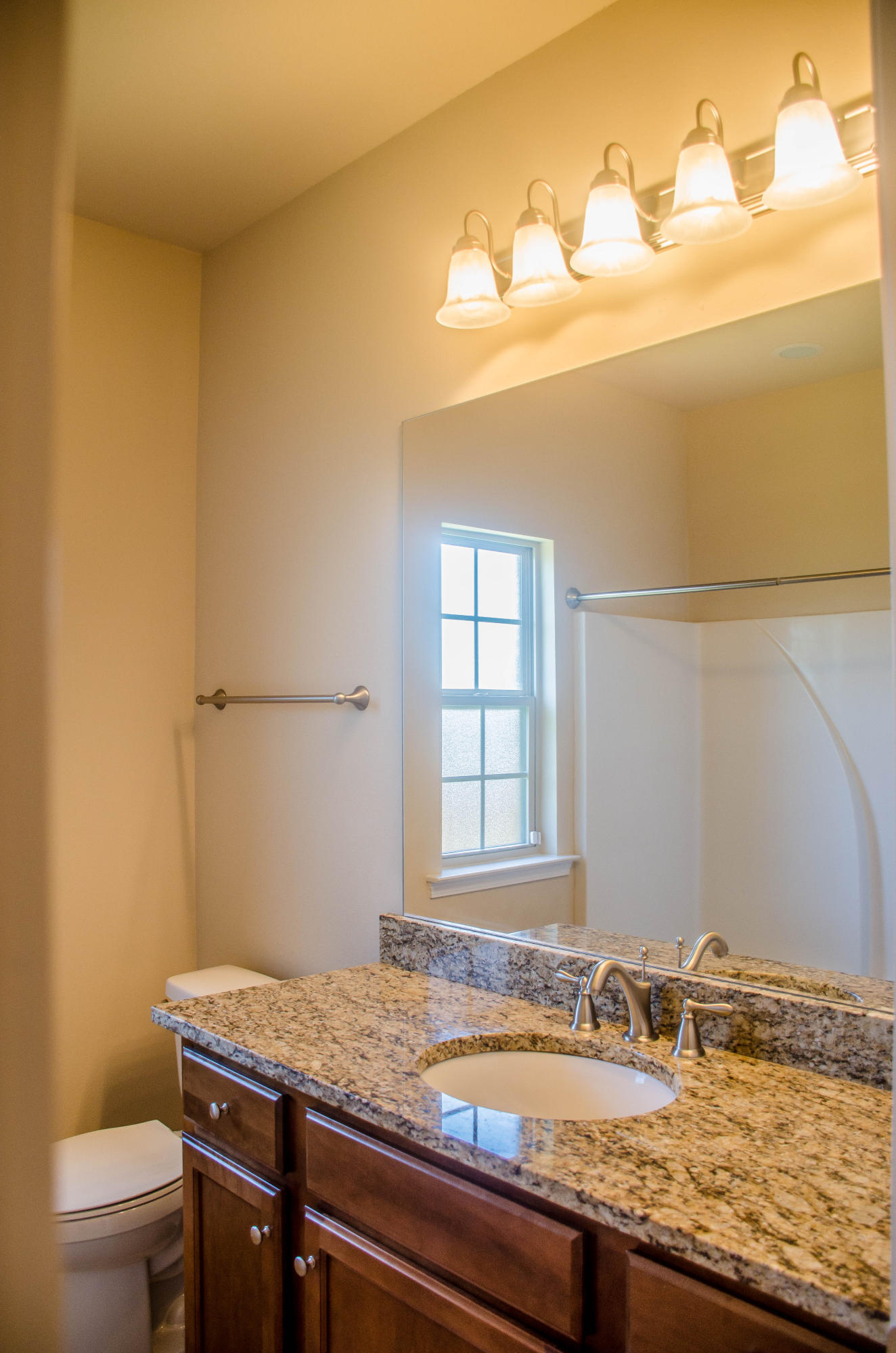 5184 Rabbit Crestview, FL 32539 - Photo 24 of 31 a bathroom with a granite countertop sink and a toilet
