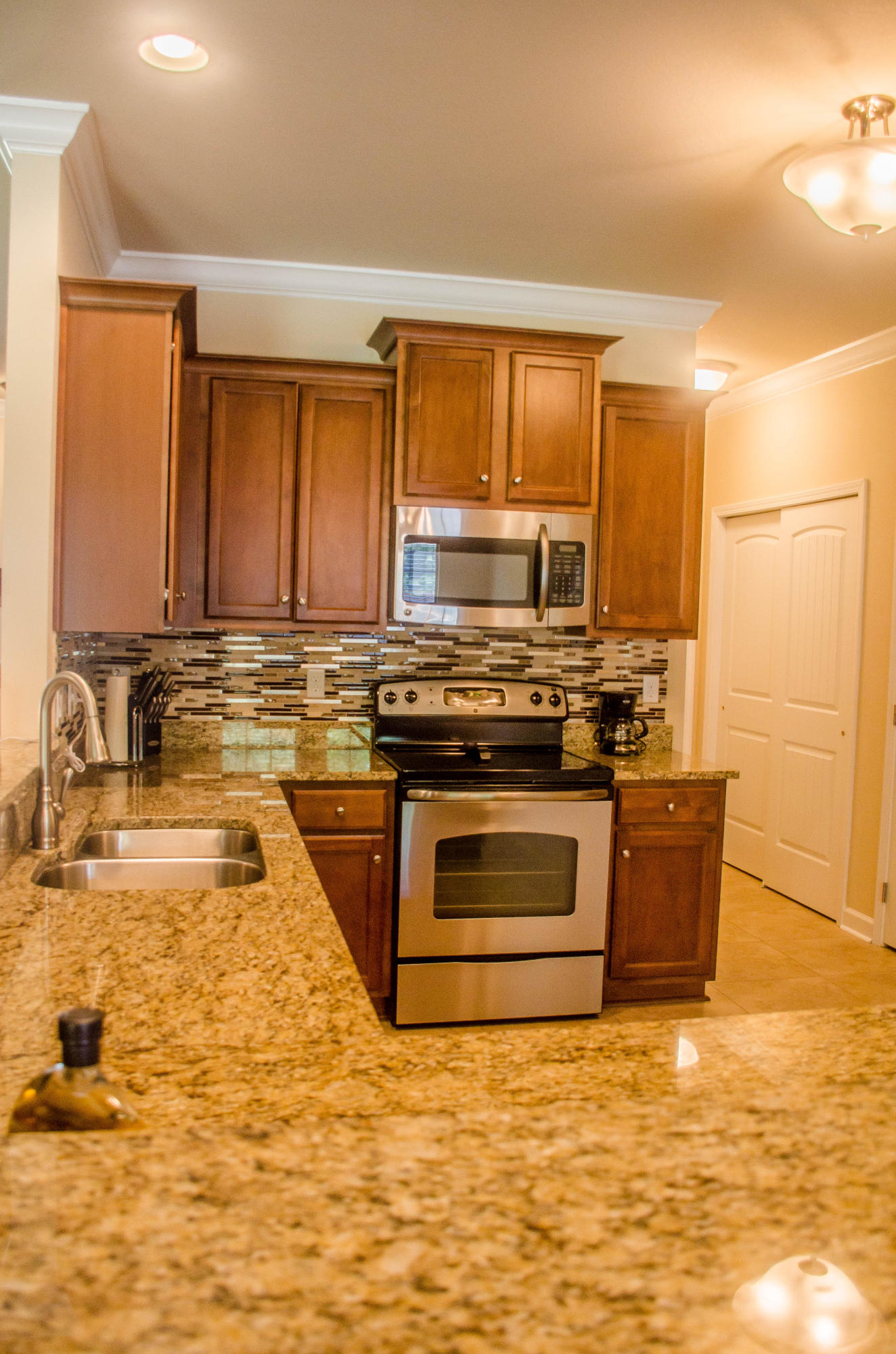 5184 Rabbit Crestview, FL 32539 - Photo 6 of 31 a kitchen with stainless steel appliances granite countertop a stove a sink and a microwave