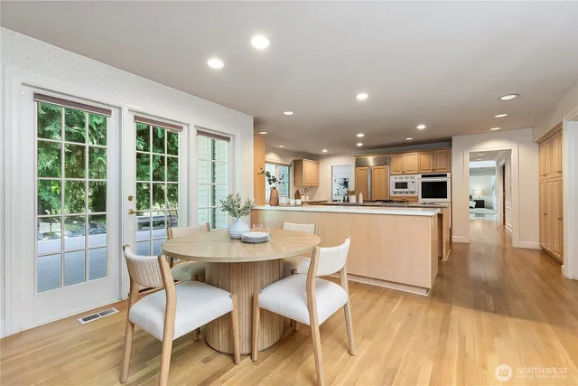 a view of a dining room with furniture and wooden floor