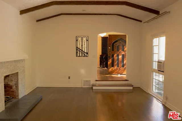 a view of a big room with closet and wooden floor