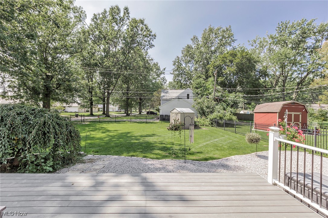 1424 Ford Road Lyndhurst, OH 44124 - Photo 32 of 35 NEWER deck! (2021) with custom landscaping and fencing and shed.