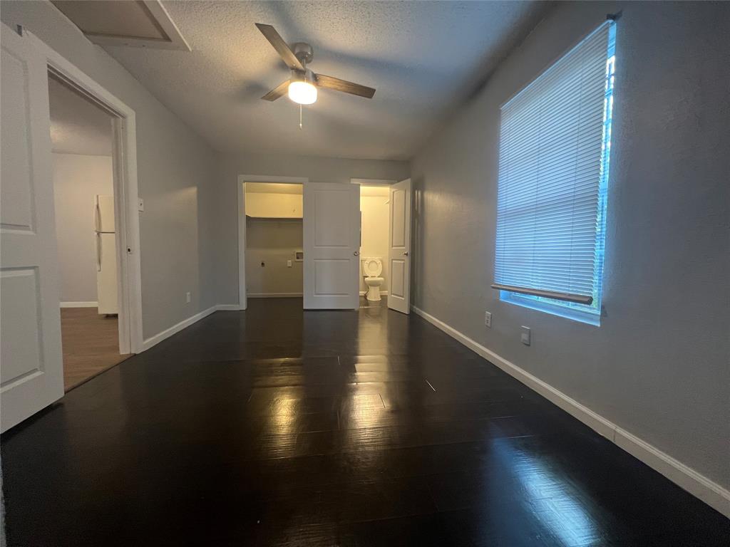 2722 Locust Avenue Dallas, TX 75216 - Photo 18 of 20 a view of a hallway with wooden floor