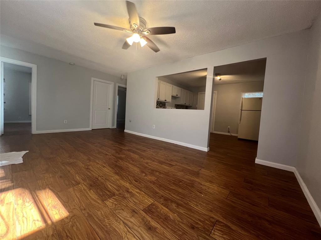 2722 Locust Avenue Dallas, TX 75216 - Photo 5 of 20 a view of an empty room with wooden floor