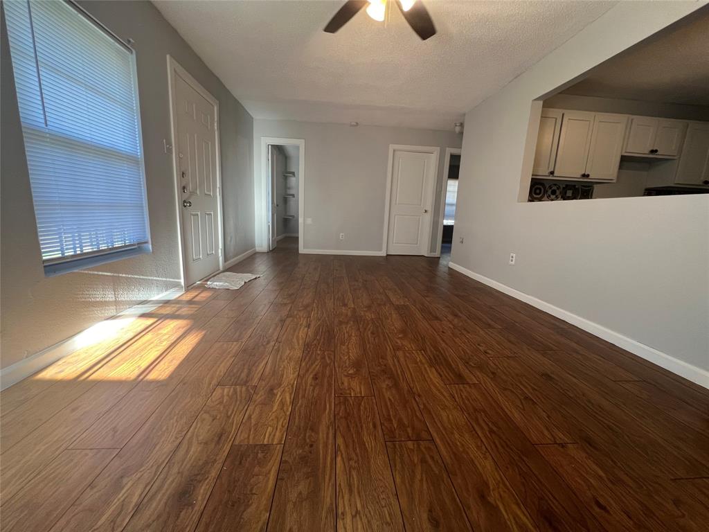 2722 Locust Avenue Dallas, TX 75216 - Photo 7 of 20 a view of a room with wooden floor and window