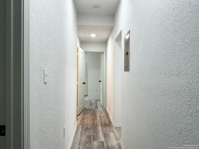 a view of a bathroom from a hallway