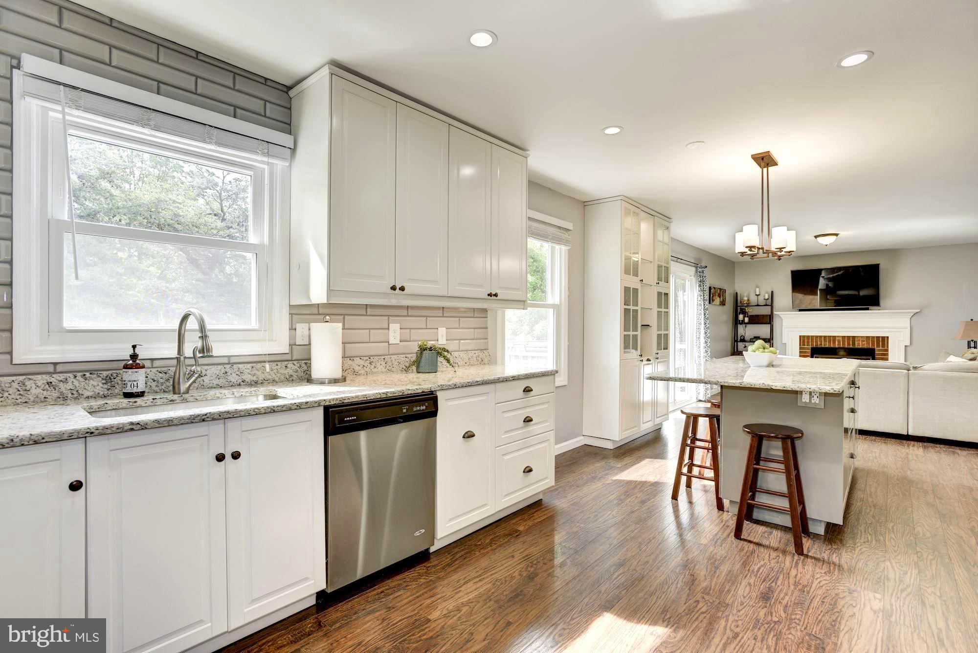 2233 Halter Lane Reston, VA 20191 - Photo 5 of 34 Tall white cabinets and granite counters