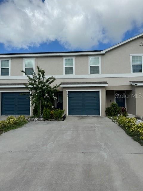 a front view of a house with yard