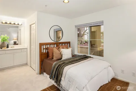 a bedroom with a large bed and a closet