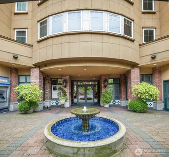 a view of a building with potted plants