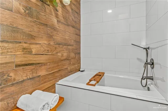 a bathroom with a bath tub