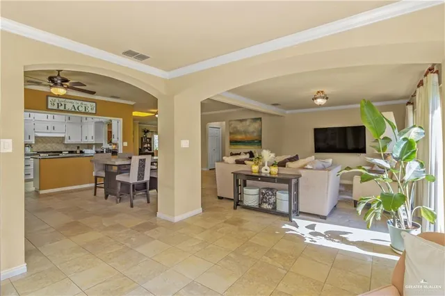 a view of a living room kitchen and a flat screen tv