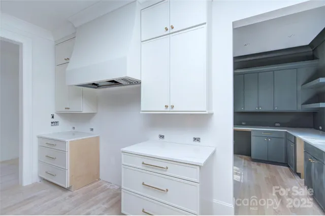 a view of cabinets and window