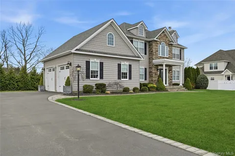 front view of a house with a yard
