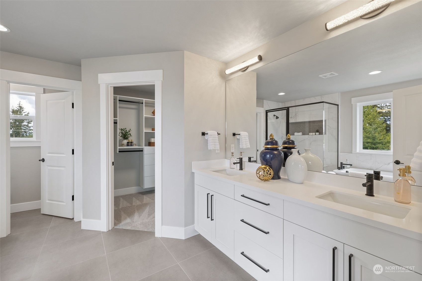 18427 1st Avenue Southeast Bothell, WA 98012 - Photo 10 of 13 a bathroom with a sink double vanity and a mirror