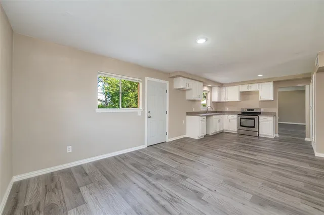 a view of kitchen with wooden floor