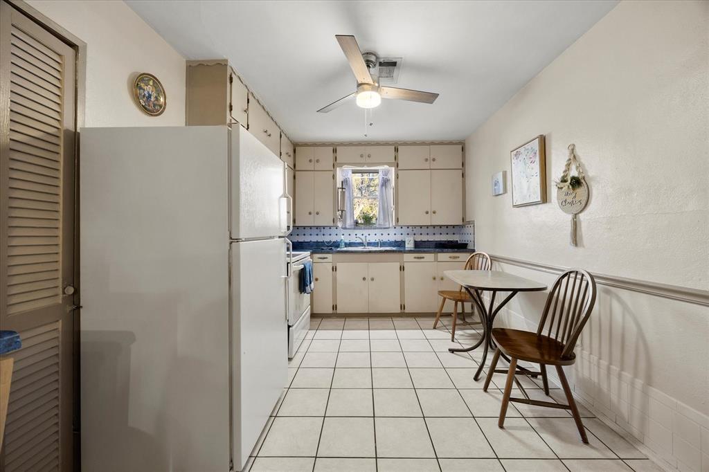 2097 County Road 3830 Quinlan, TX 75474 - Photo 12 of 38 a view of kitchen with cabinets and outdoor space