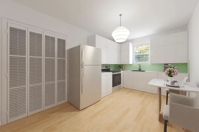 a kitchen with refrigerator cabinets and furniture
