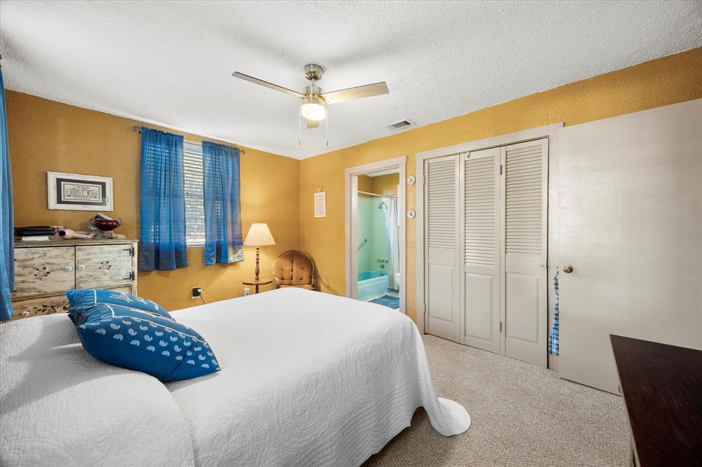 2097 County Road 3830 Quinlan, TX 75474 - Photo 16 of 38 a bedroom with a bed and wooden floor