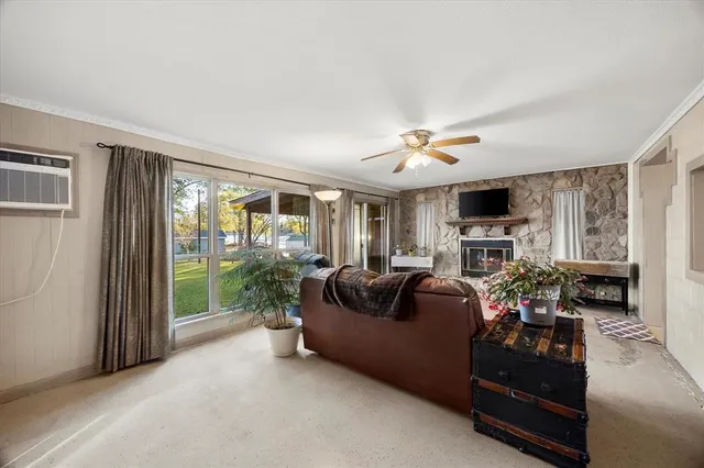 a living room with furniture fireplace and flat screen tv