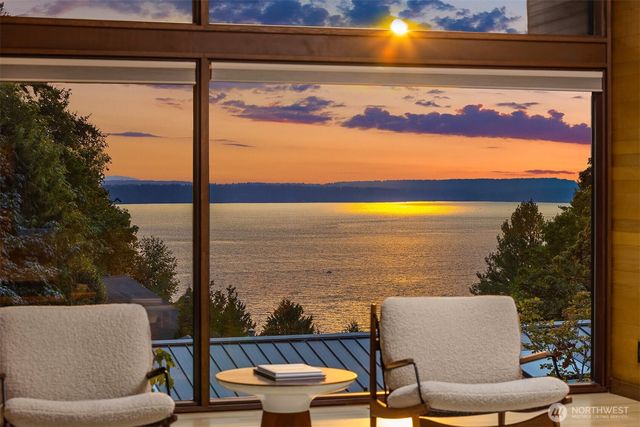 a view of a balcony with chairs