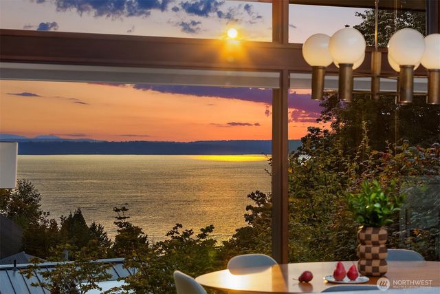 a view of a balcony with chair and table