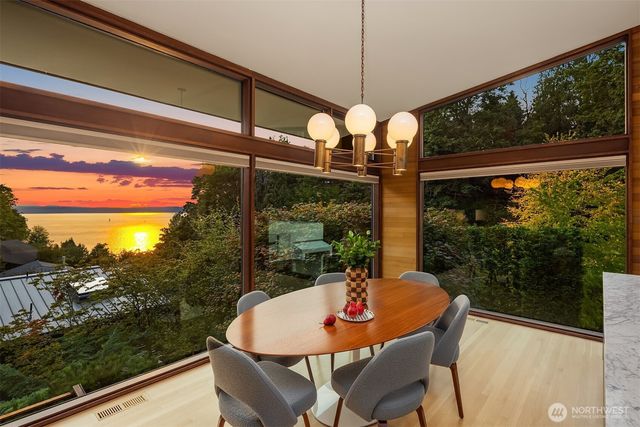 a view of a dining room with furniture window and outside view