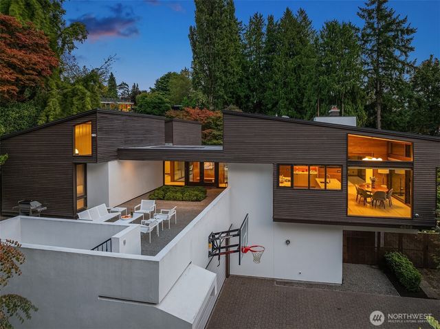 a view of a backyard with swimming pool