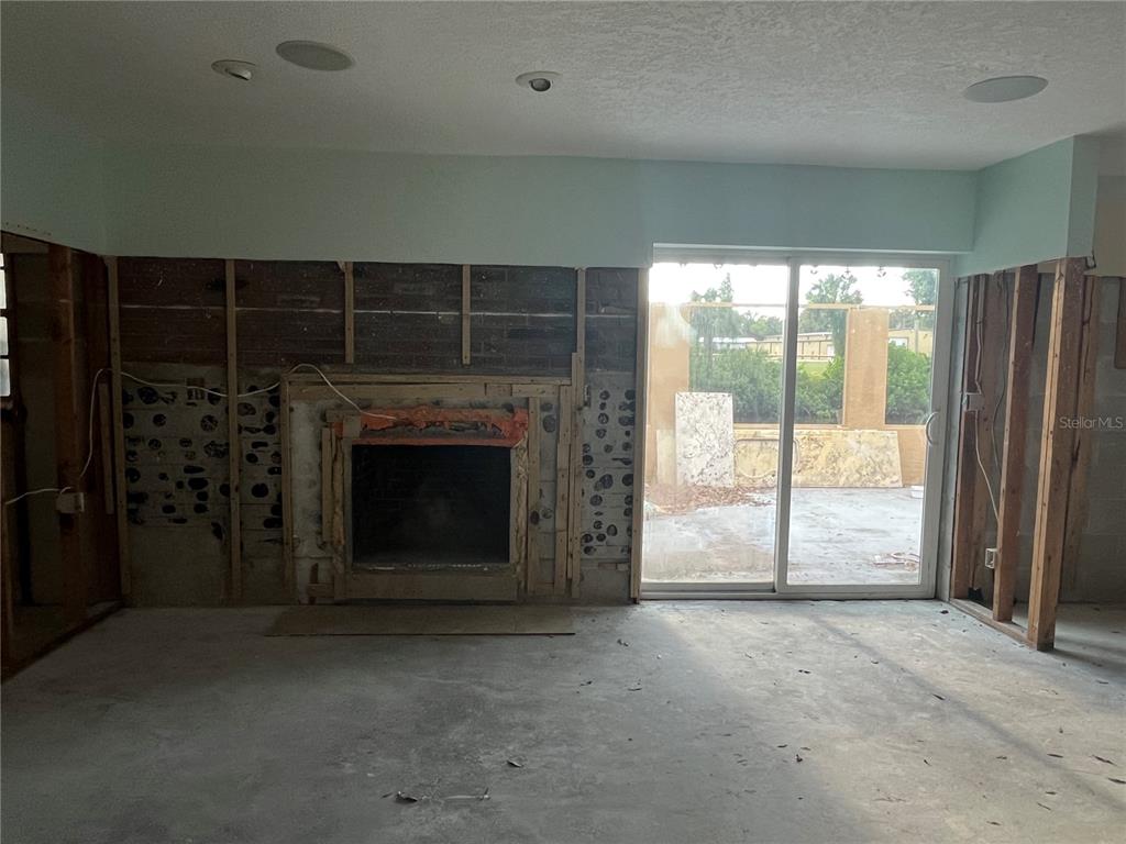 8823 Oak Street Riverview, FL 33578 - Photo 11 of 23 a view of an empty room with a fireplace