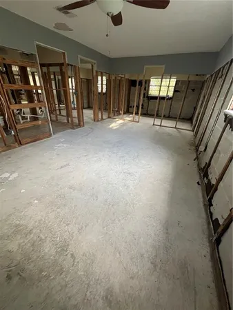 a view of an empty room with windows