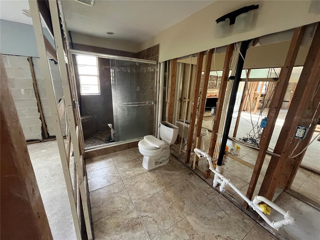 8823 Oak Street Riverview, FL 33578 - Photo 17 of 23 a bathroom with a shower and toilet