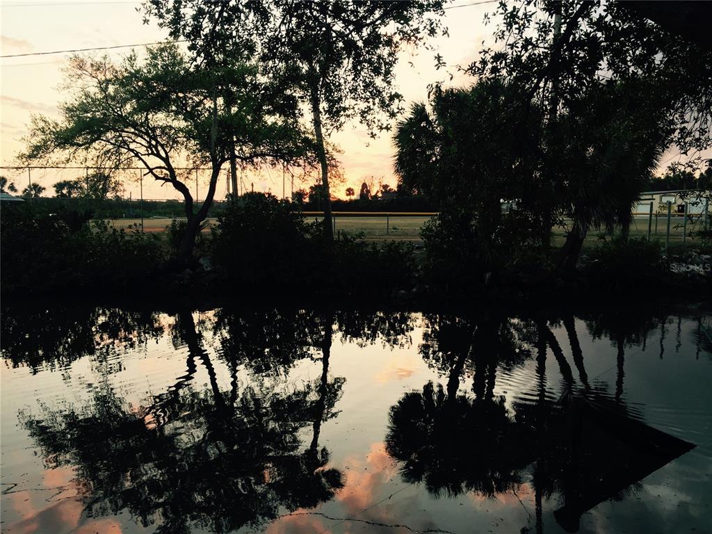 8823 Oak Street Riverview, FL 33578 - Photo 9 of 23 a view of a lake in between two trees