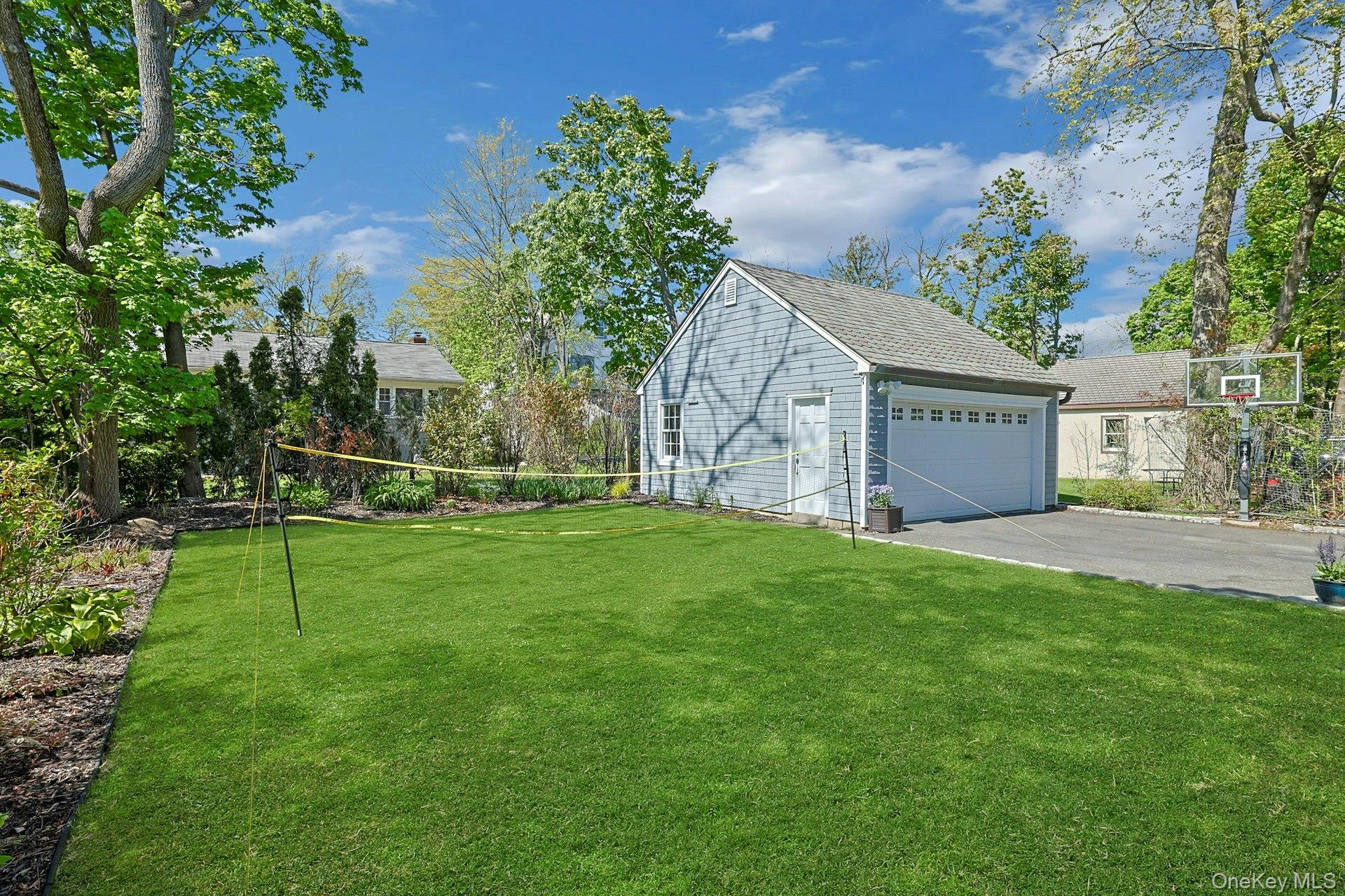 33 Lawrence Road Scarsdale, NY 10583 - Photo 2 of 8 An inviting stretch of green space—ideal for play, lounging, or simply enjoying the outdoors.