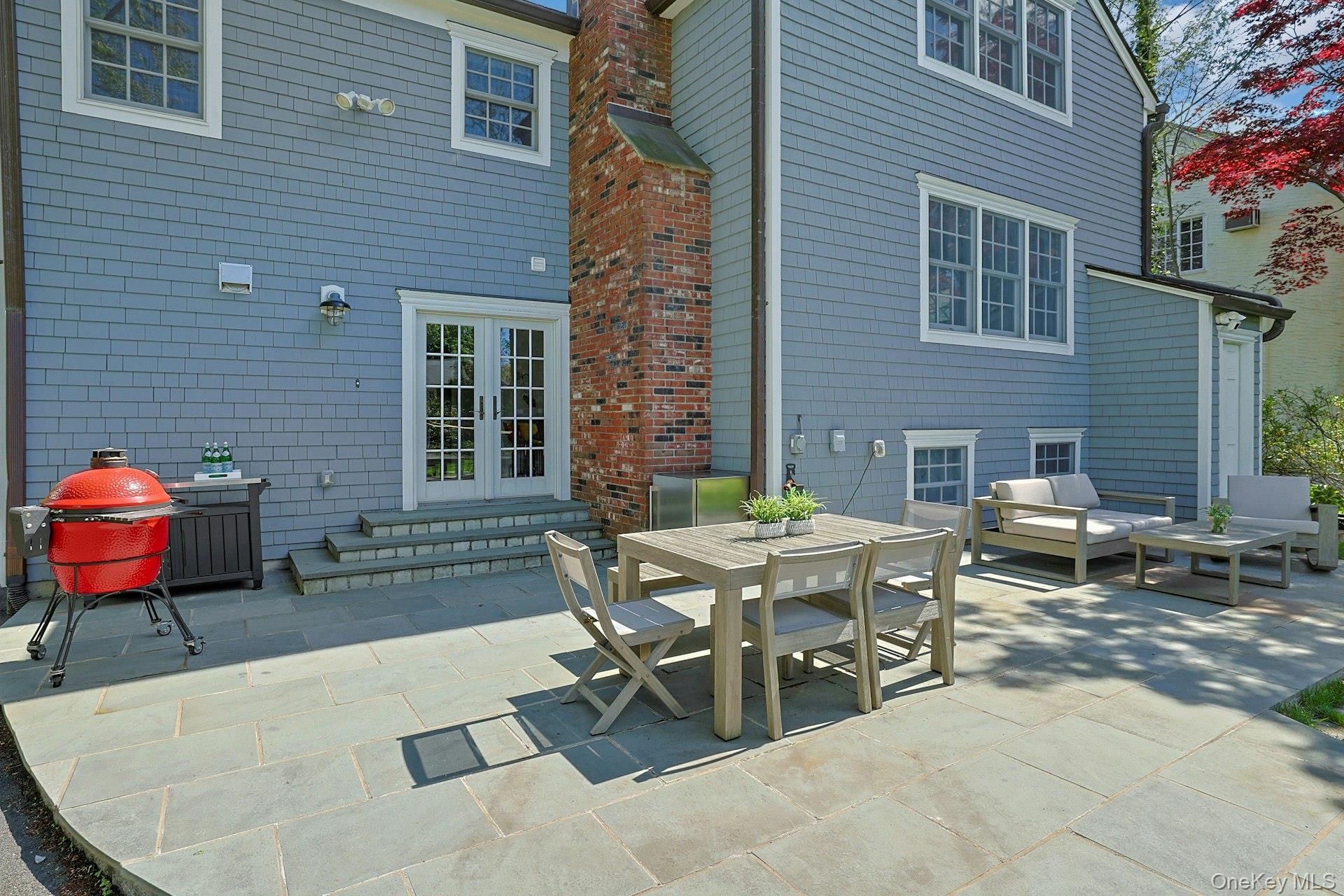 33 Lawrence Road Scarsdale, NY 10583 - Photo 3 of 8 A beautifully designed bluestone patio with ample room for dining, grilling, and gathering under the open sky.
