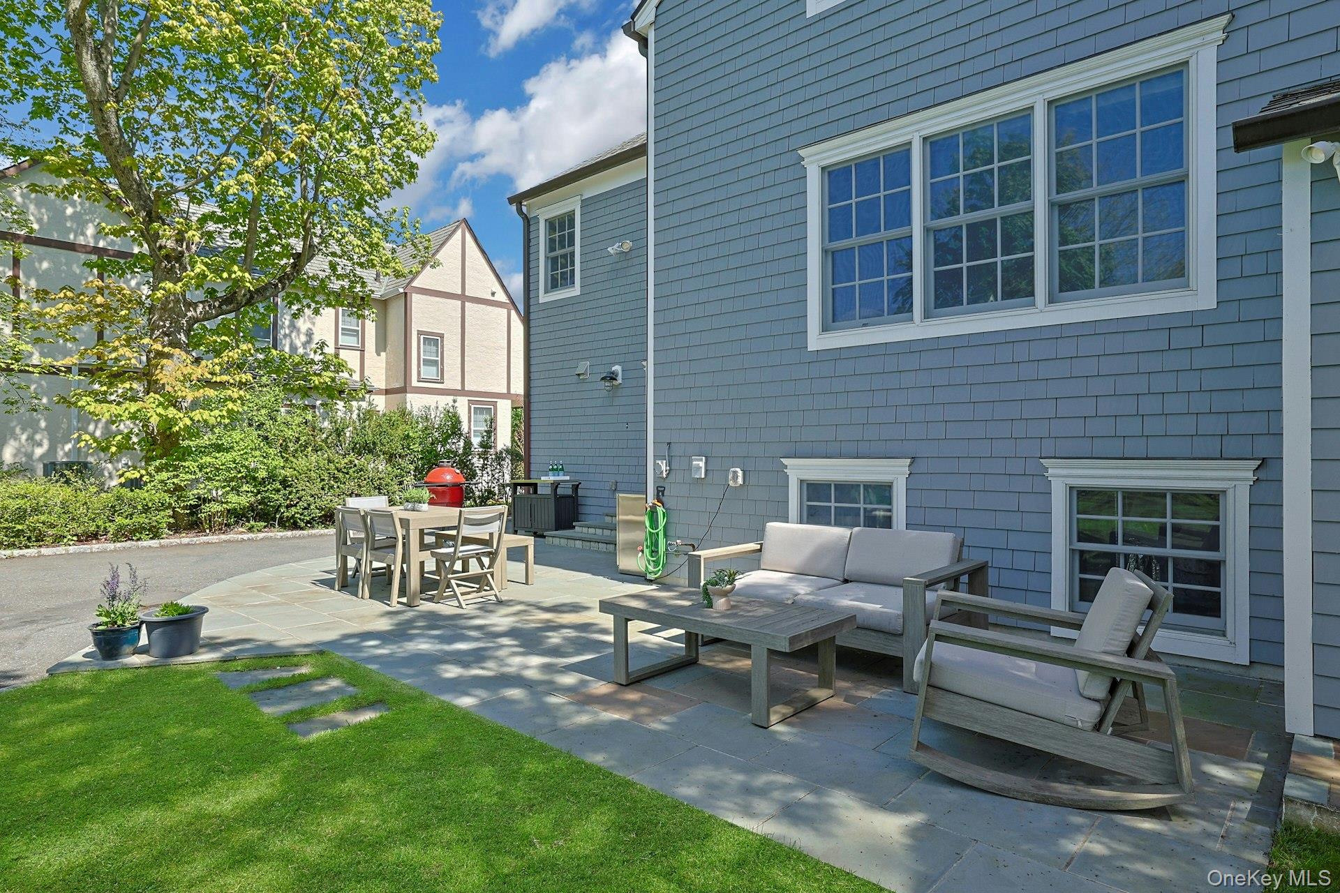 33 Lawrence Road Scarsdale, NY 10583 - Photo 6 of 8 Thoughtfully arranged outdoor living spaces create an easy, relaxed setting for entertaining or unwinding.