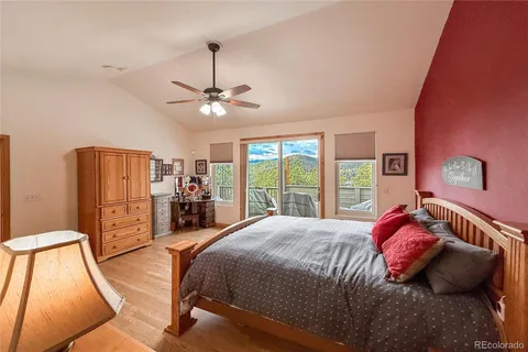 a bed room with a bed and a chandelier