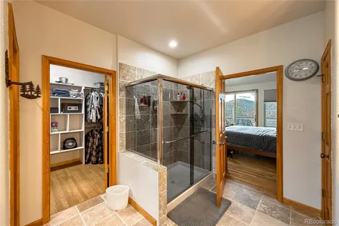 a bathroom with a tub and a shower