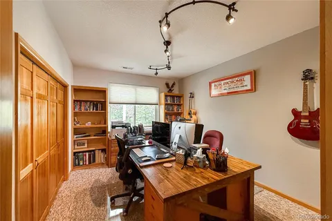 a workspace with furniture and window