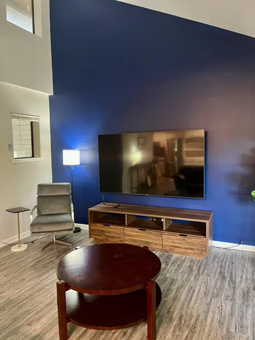 a room with furniture and wooden floor