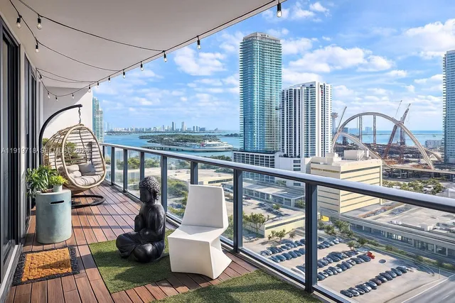 a view of a balcony with lake view and wooden floor