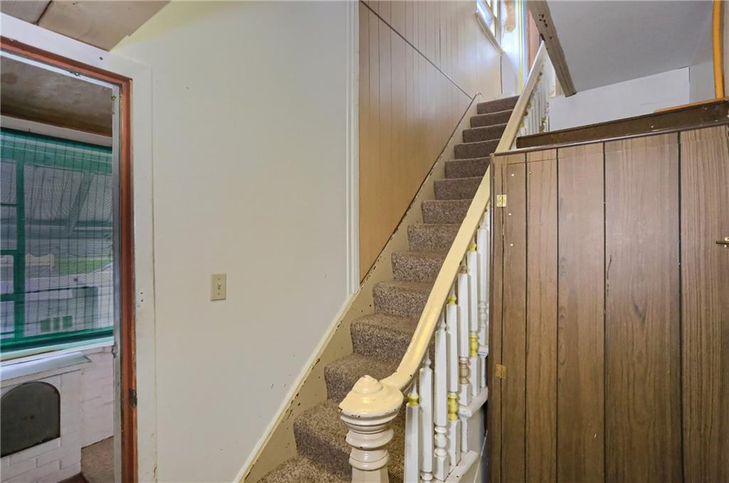 516 17th Street Beaver Falls, PA 15010 - Photo 15 of 28 a view of a hallway with toilet and shower