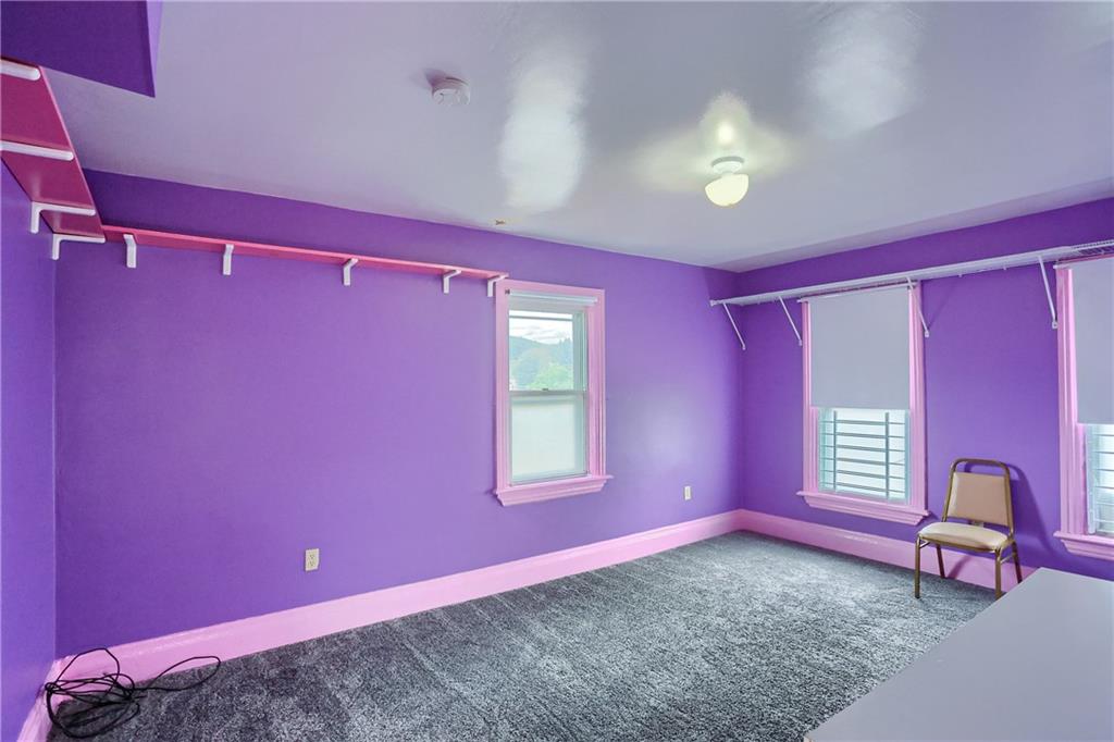516 17th Street Beaver Falls, PA 15010 - Photo 16 of 28 a view of a livingroom with furniture window and a ceiling fan