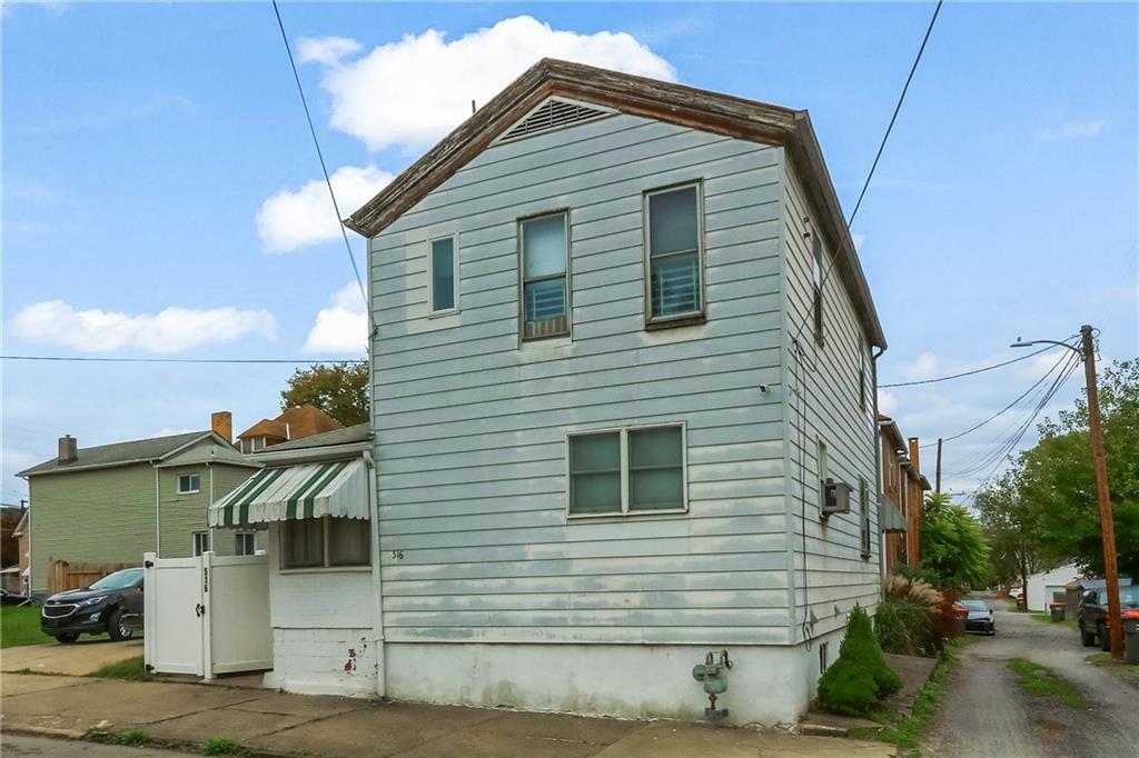 516 17th Street Beaver Falls, PA 15010 - Photo 2 of 28 a view of a house with a yard